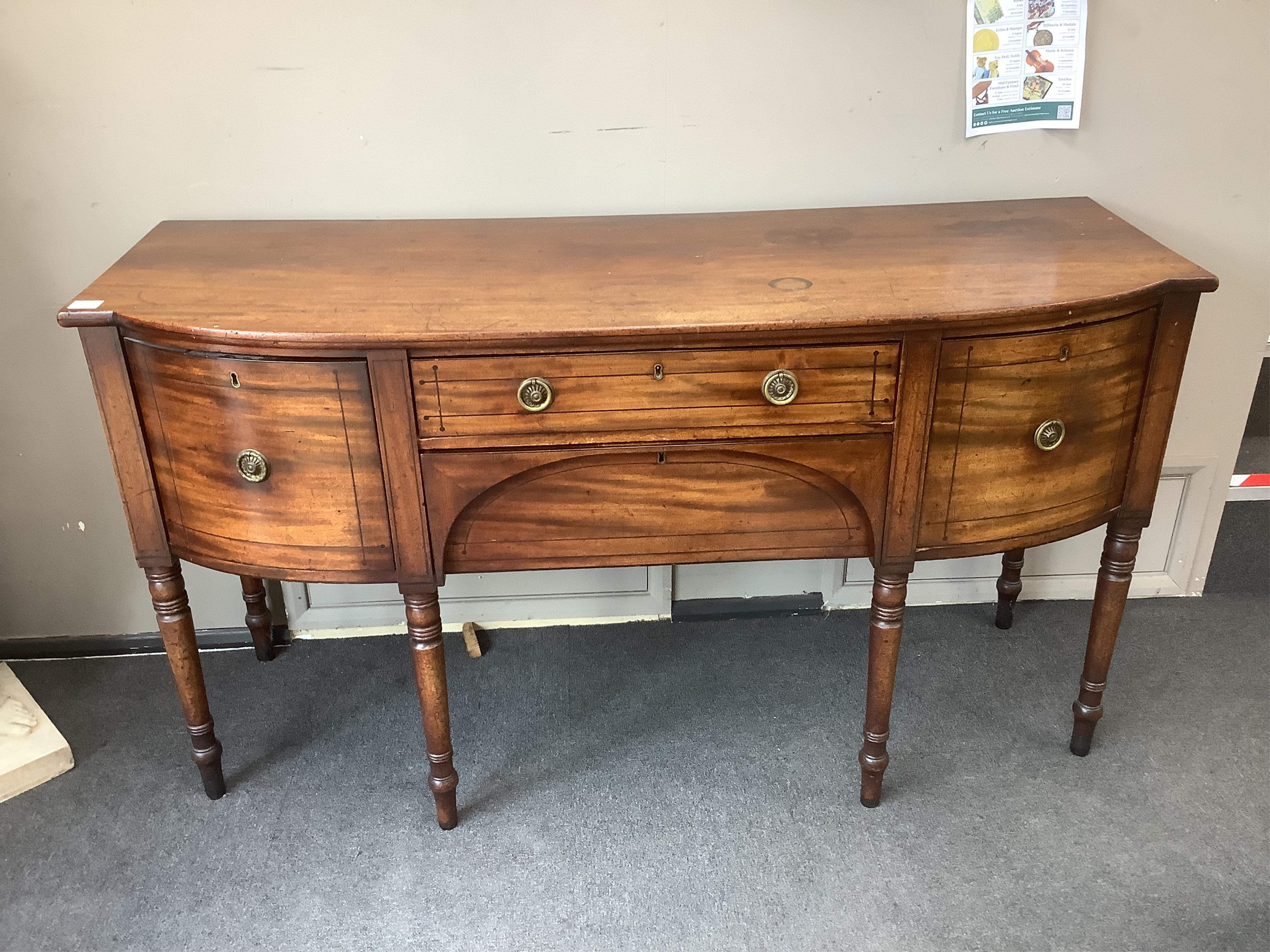 A Regency ebony strung mahogany bowfront sideboard, width 165cm, depth 58cm, height 90cm. Condition - fair